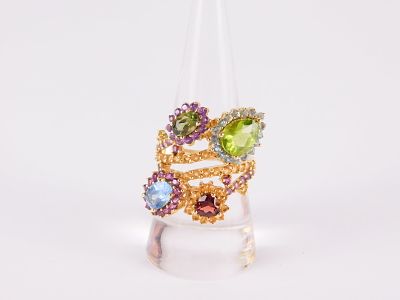 14k Yellow Gold Multi-Gemstone Ring. In a wrap around style with a pear shaped peridot, an oval 