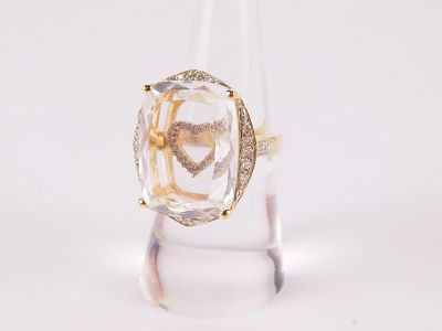 14k Yellow Gold and Diamond Ring. Single band with small round diamonds on the shoulders and a 