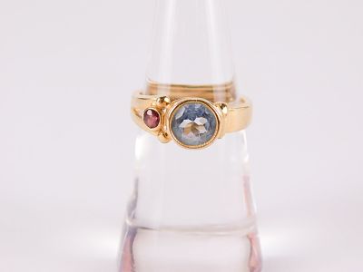 14k Yellow Gold, Aquamarine, and Ruby Ring. Wide band that separates at the other end into a 