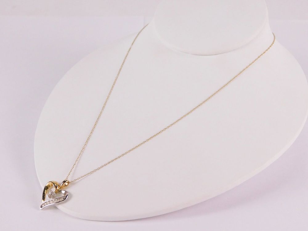 Lot 181: 10k Yellow & White Gold Heart Pendant