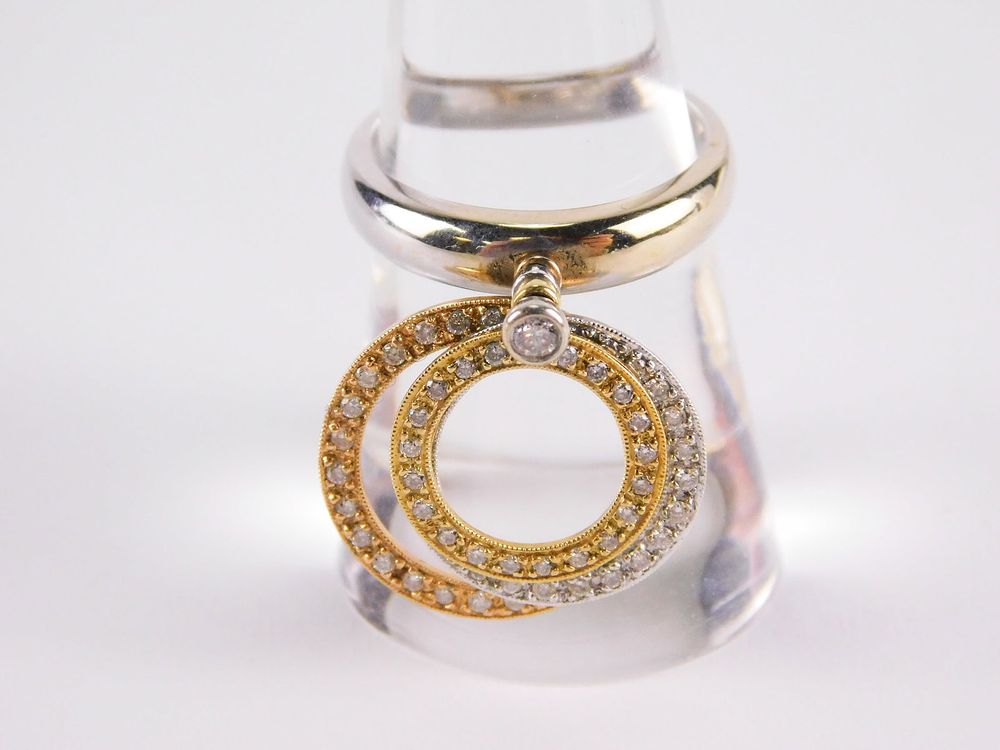 Lot 196: 18k White Gold & Diamond Articulating Circles