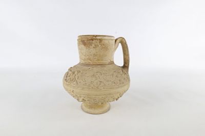 Ancient Pottery Ewer. Middle Eastern - circa 12th century. Has raised animal and heart design. 