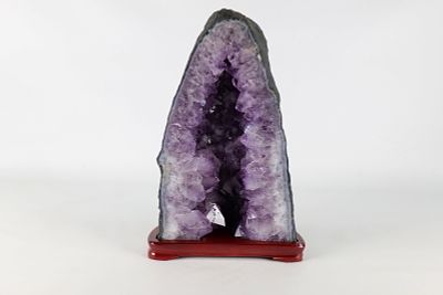 Amethyst Geode. Comes with detachable wooden base, has damage. Measures 14 inches tall by 7 and 