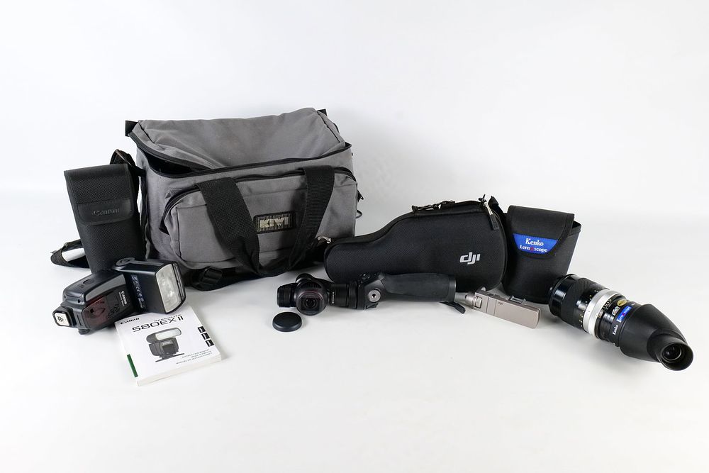 Lot 249: A Collection of DJI Osmo Canon Flash and Nikon Lens