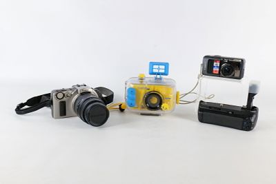 An Assortment of Photographic Equipment. Assortment of cameras including a Canon EOS IX SLR with 