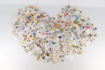 A Collection of Paper US and International Stamps. A collection of US and international postage 