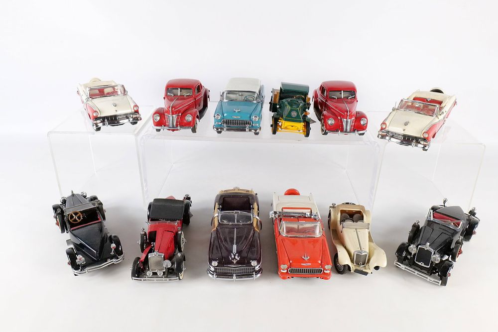 Lot 276: A Collection of 12 Franklin Mint and Danbury Mint 1:24 Scale Die-cast Model Vehicles
