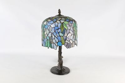 Leaded Glass Wisteria Motif Table Lamp. A leaded glass table lamp featuring a domical shade with 
