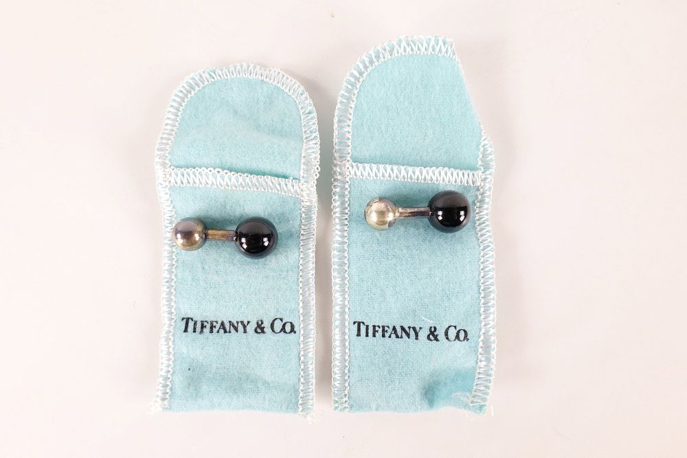 Lot 358: A Pair of Tiffany & Co. Sterling Silver and Black Onyx Barbell Cufflinks