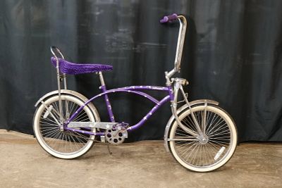 Vintage Bratz Bike. Nice purple with star design throughout and velvet banana seat, spring 
