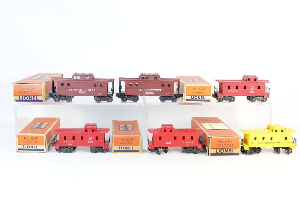 Lot 383: Lot of (6) Vintage Lionel 0/27 Postwar Cabooses most in boxes