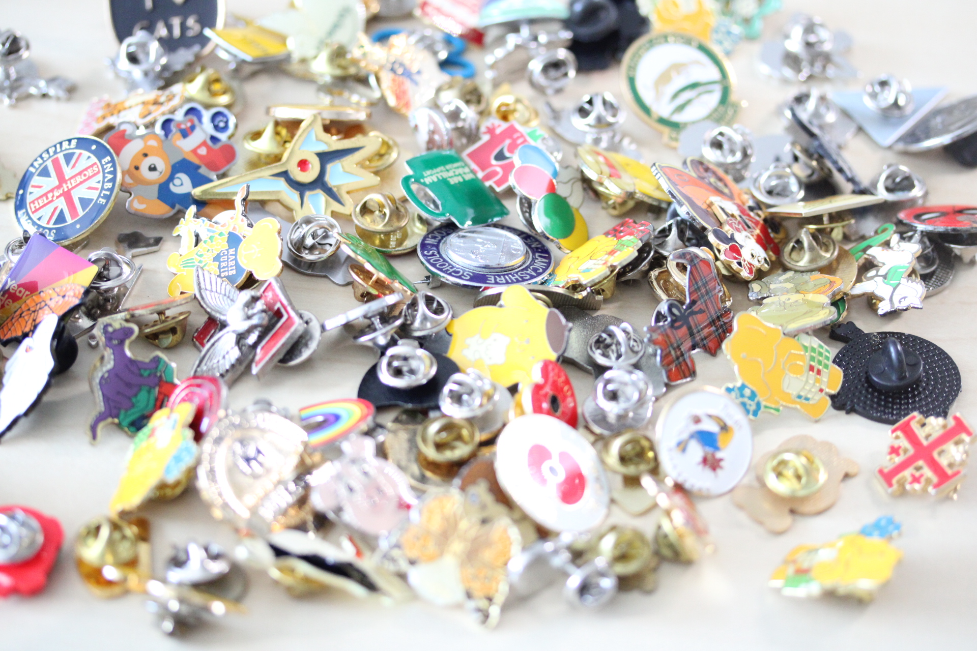 Large collection of pin badges - some vintage