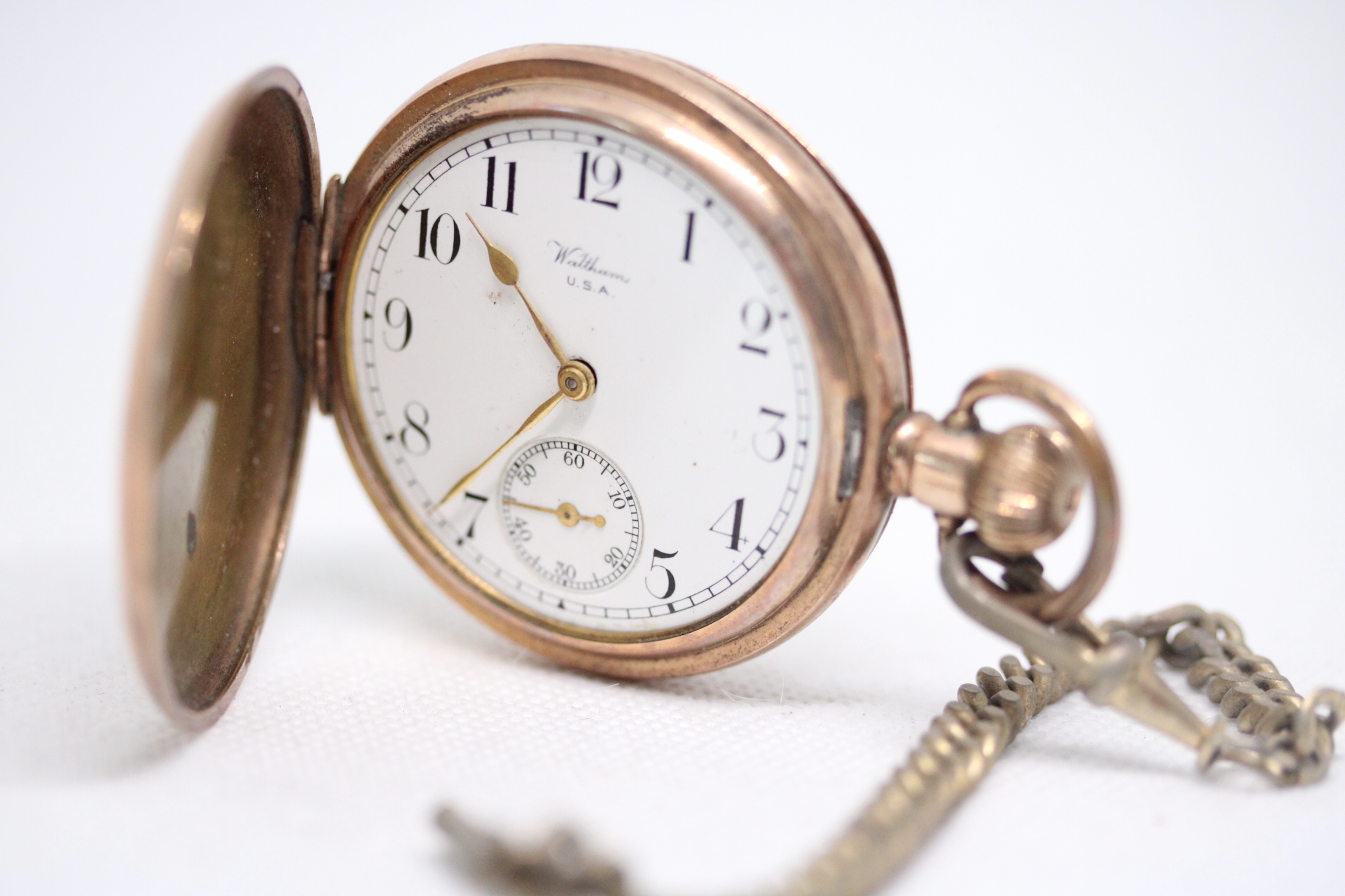 Gold plated Waltham pocket watch with albert chain currently ticking