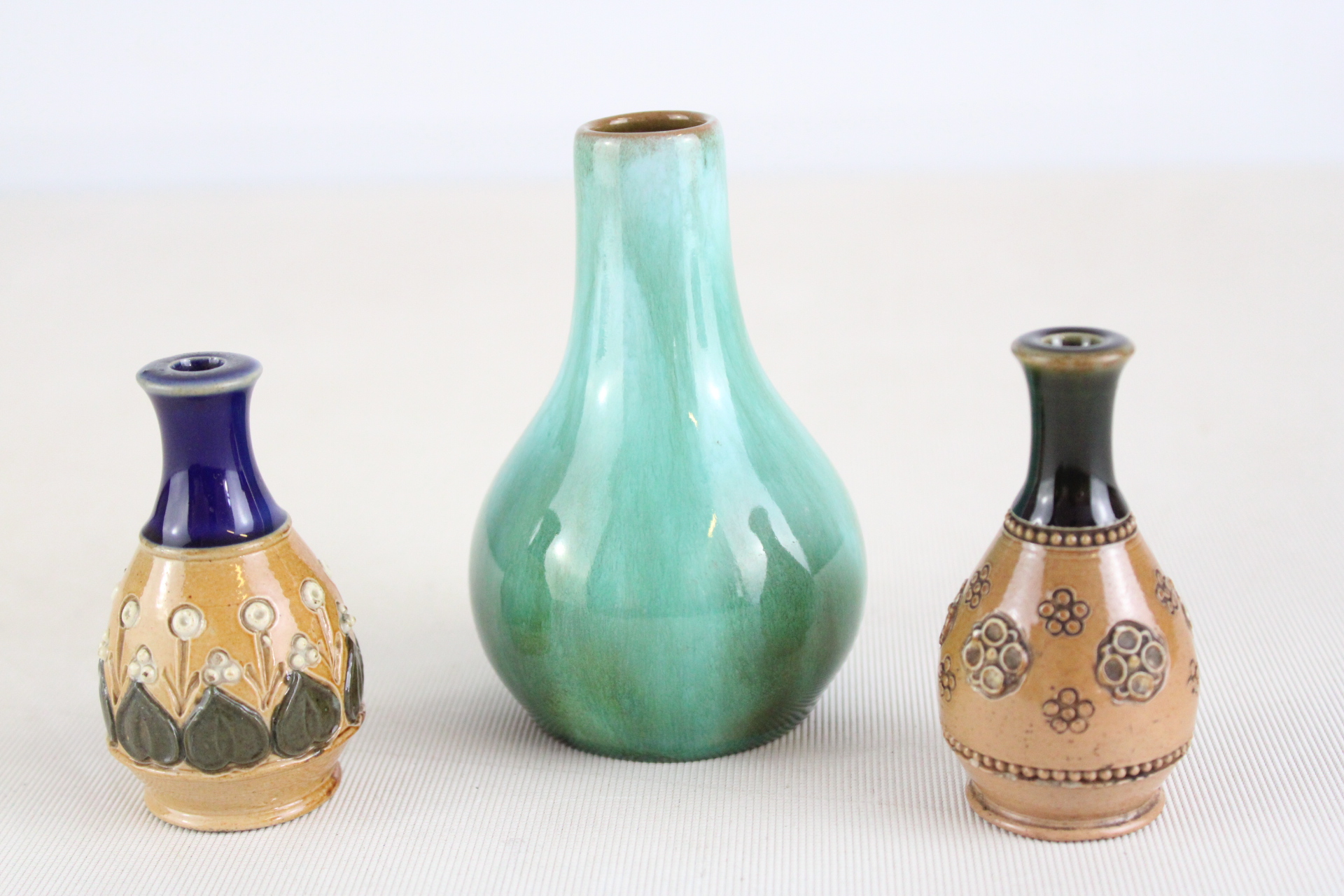 Three Royal Doulton Lambeth Stoneware and Glazed Miniature Vases