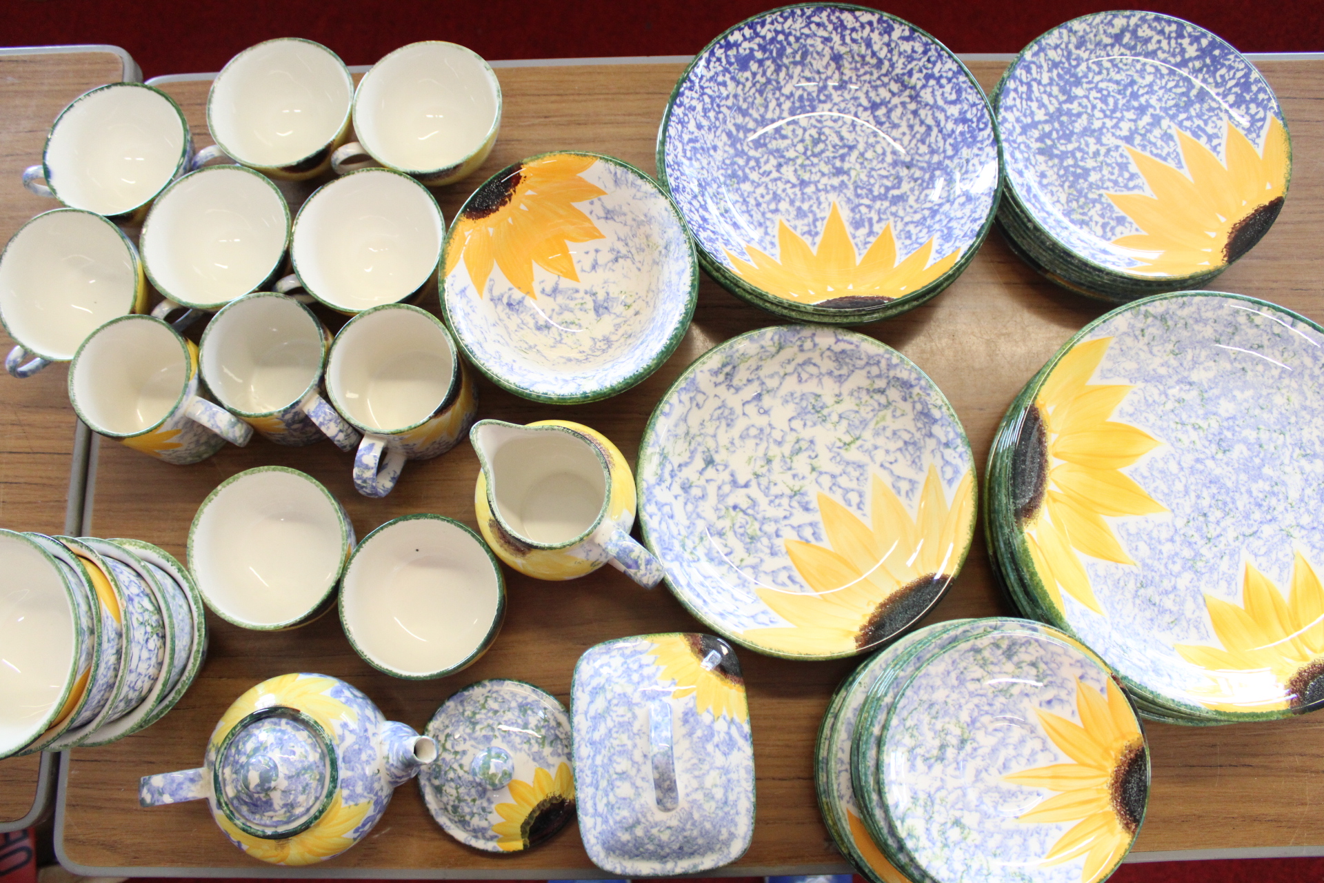 A Collection of Poole Pottery Sunflower Pattern Earthenware Dinner and Tea Service Pieces