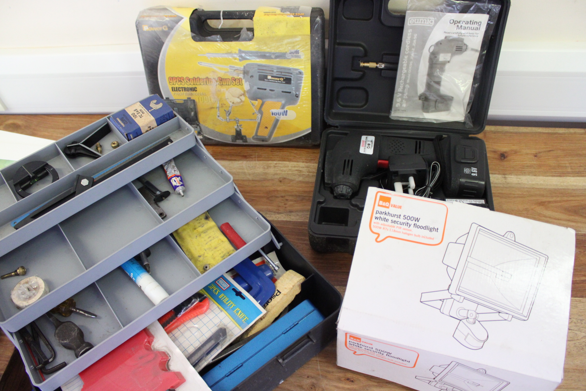 An Assortment of Power Tools, Hand Tools, and a Security Floodlight