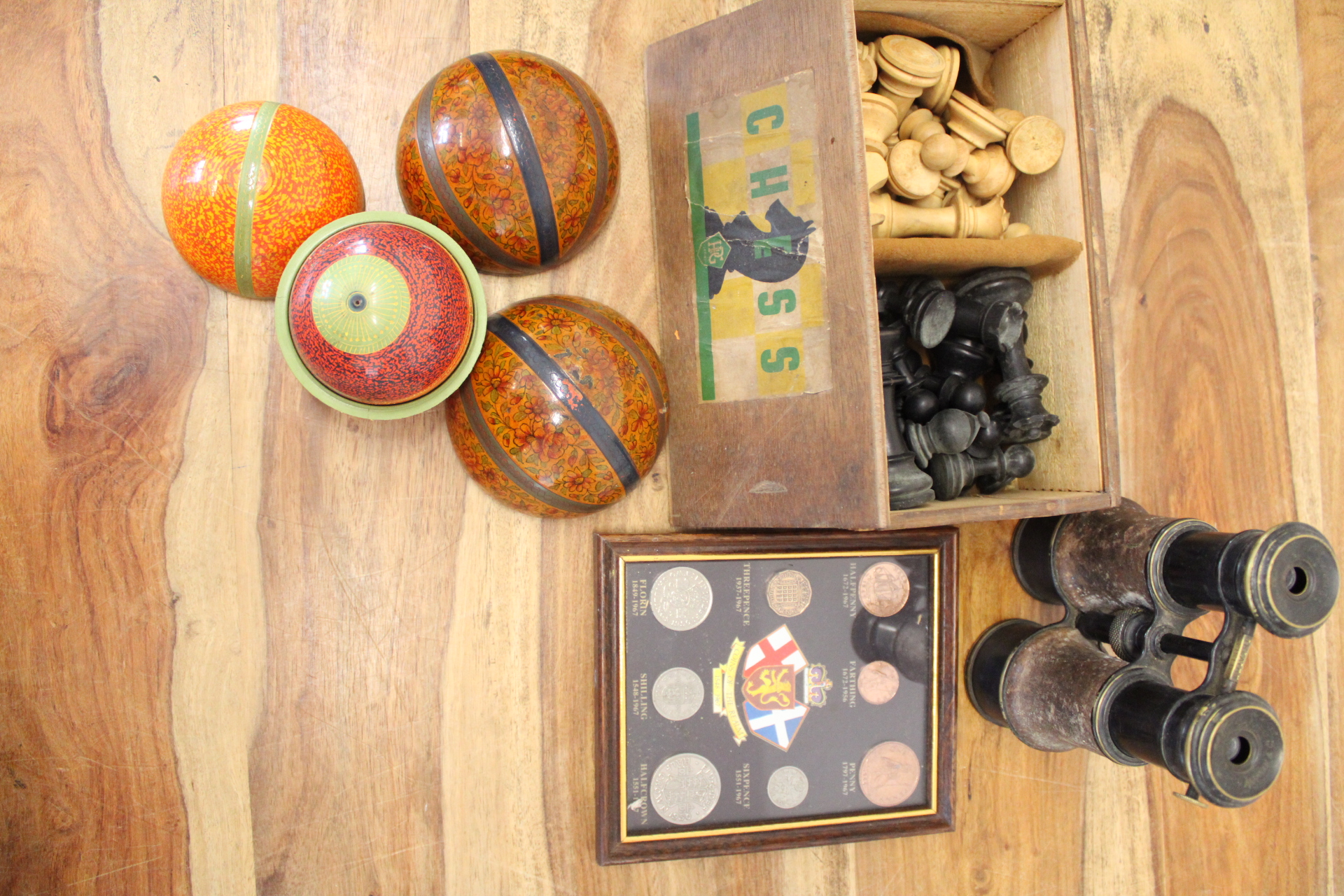 An Assortment of Victorian Style Table Croquet Balls, Chess Set, Field Binoculars, and Framed British Coinage