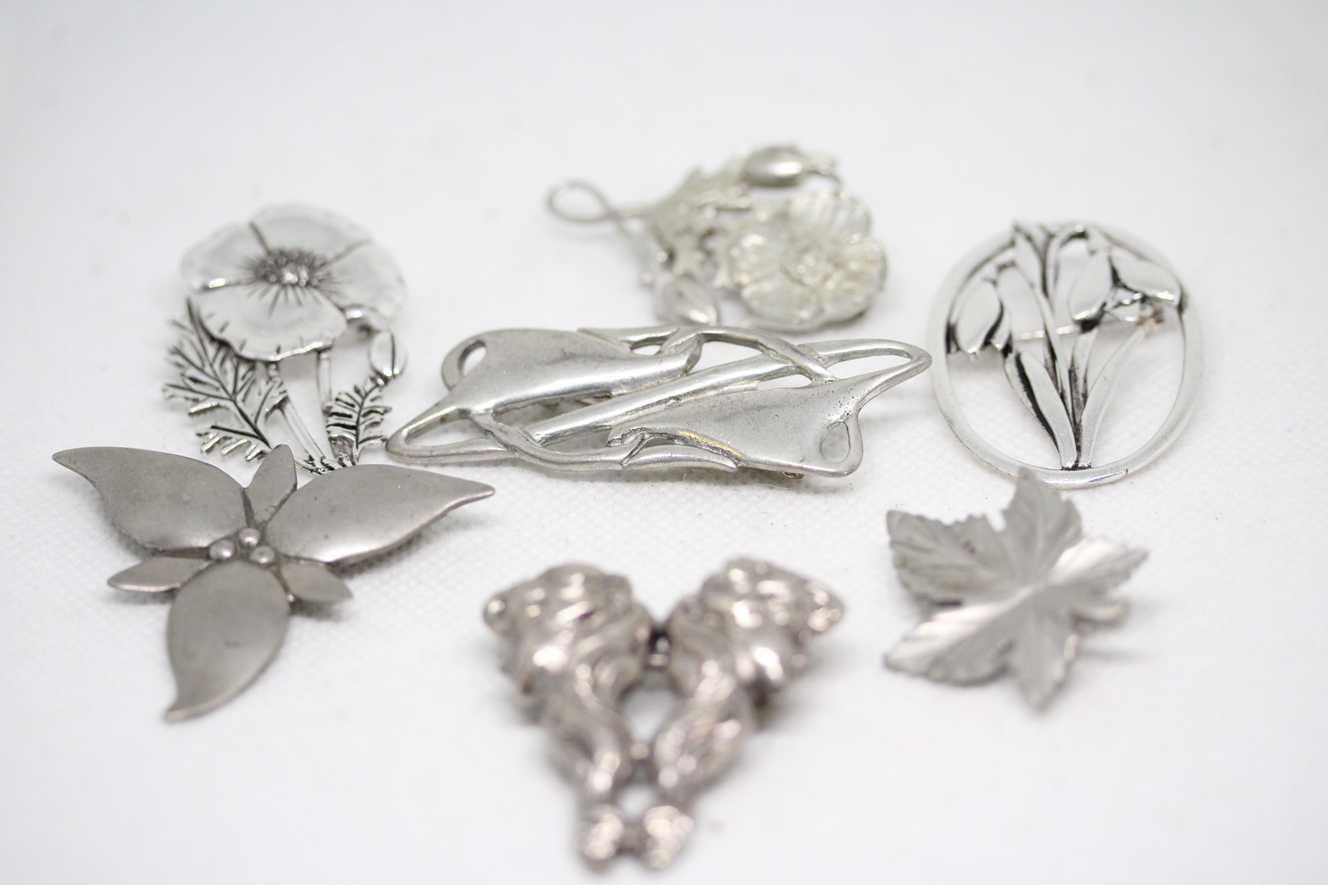 Pewter pin brooches to include Norweign petwer