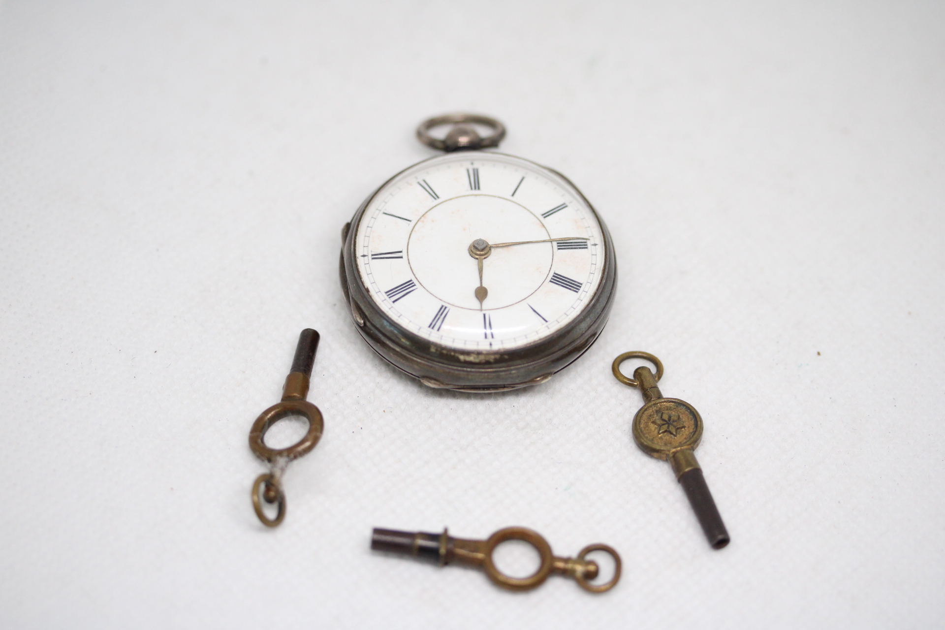 Silver case fob watch with 3 keys