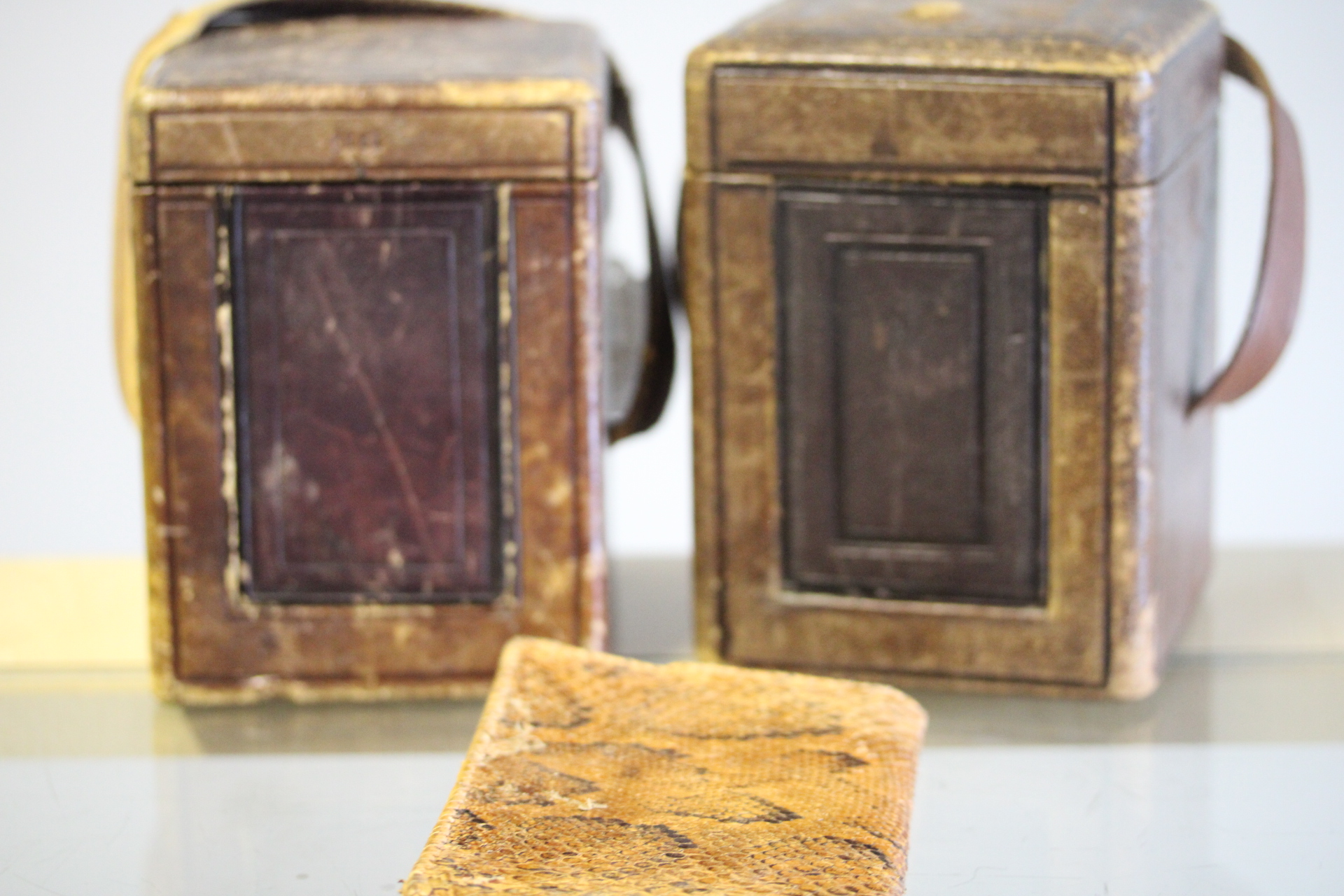 2x Vintage leather carriage clock cases together with possible snake skin wallet