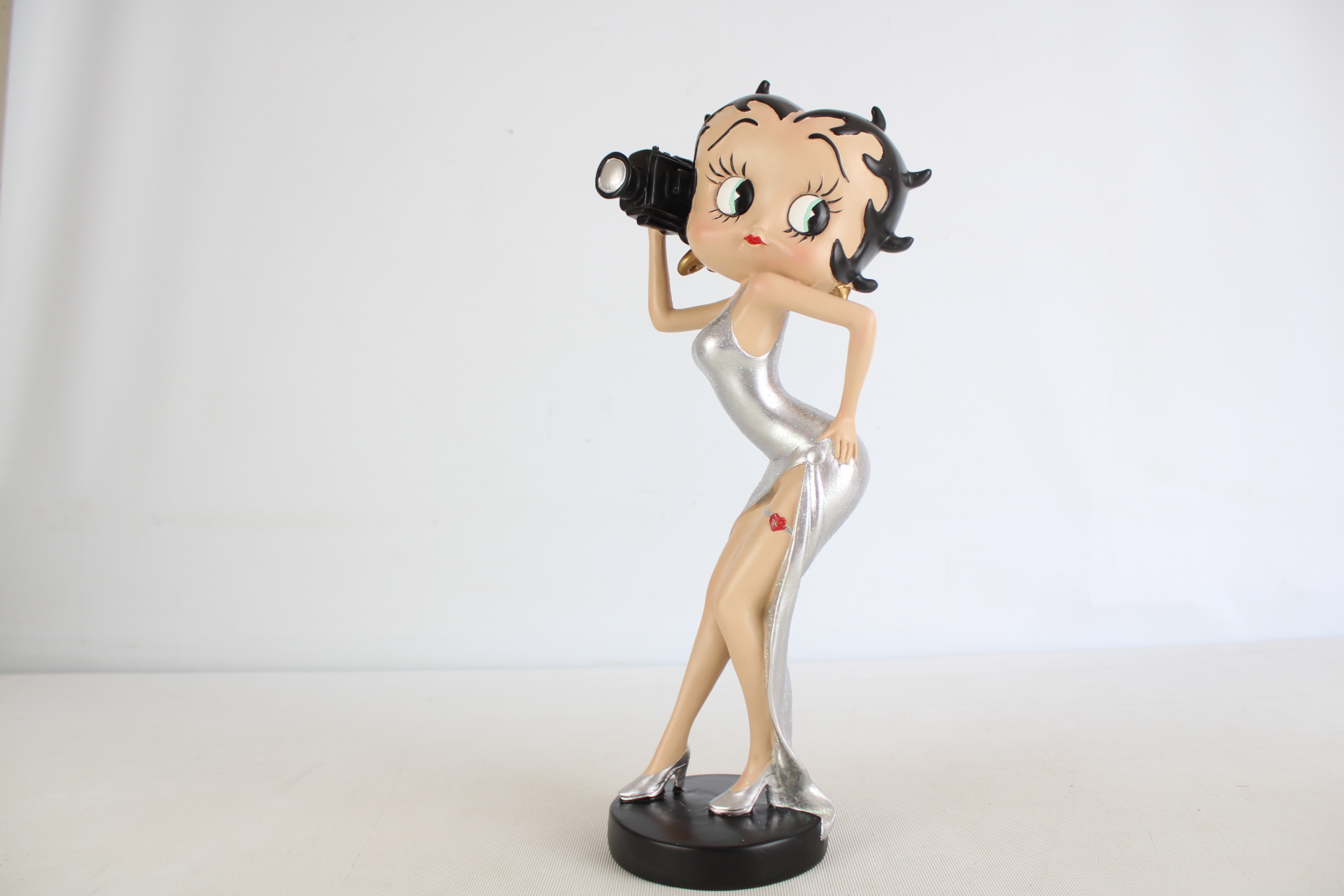 Betty Boop figure photographer in silver dress