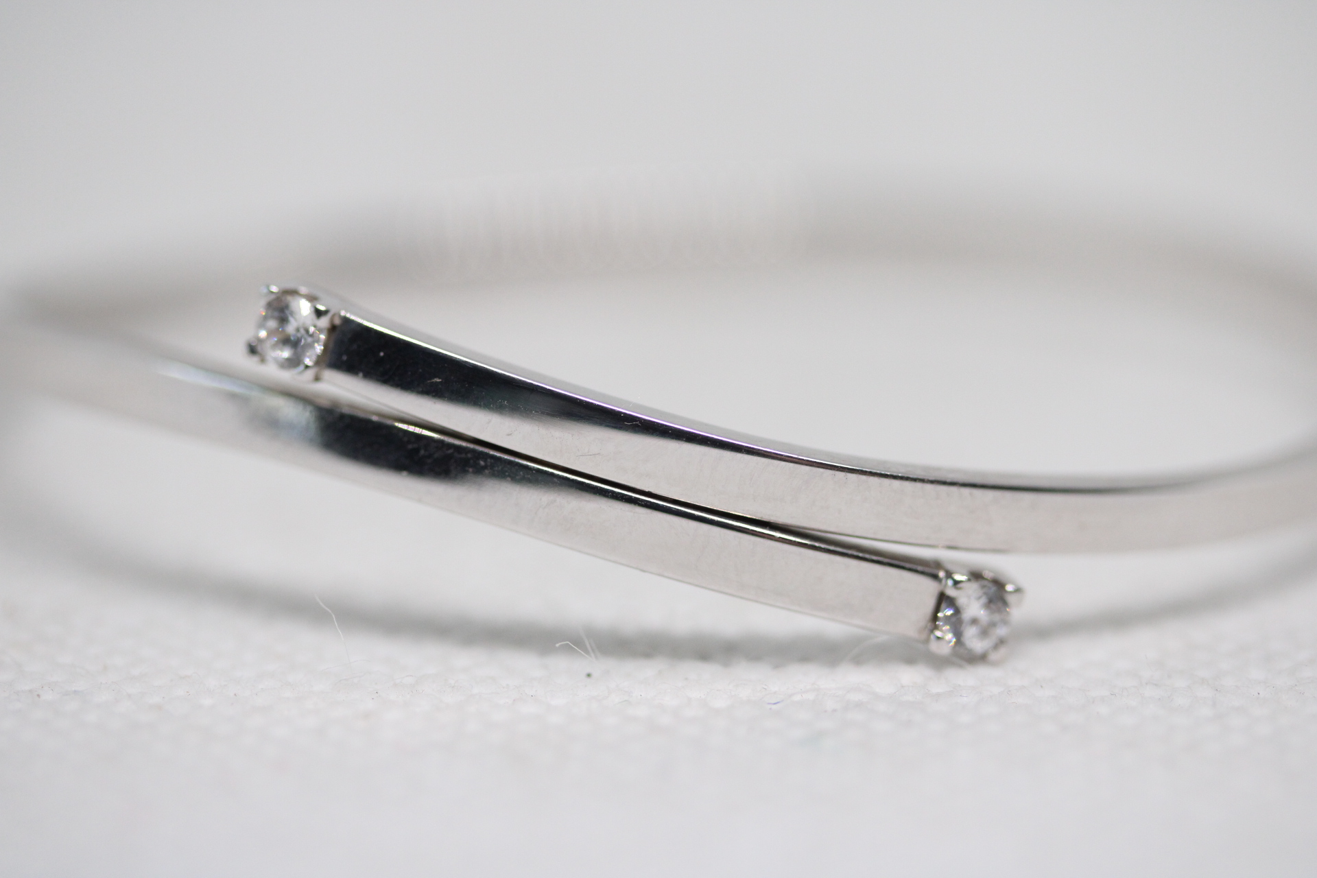 9ct White gold bangle with 2 white gem stones Weight 4.9g