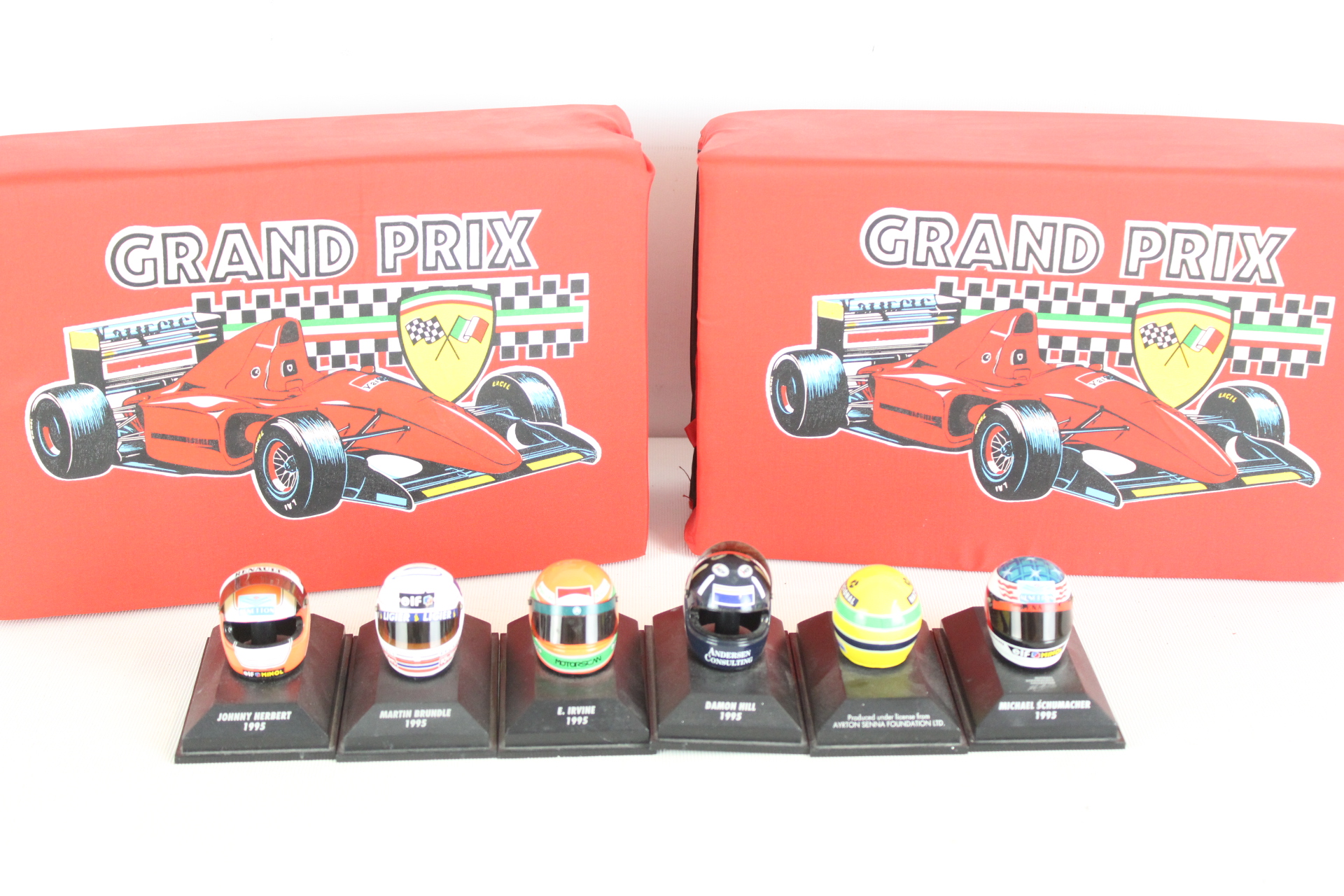 A Set of Six Formula 1 Miniature Driver Helmets from the 1995 Season with Two Branded Storage Cases