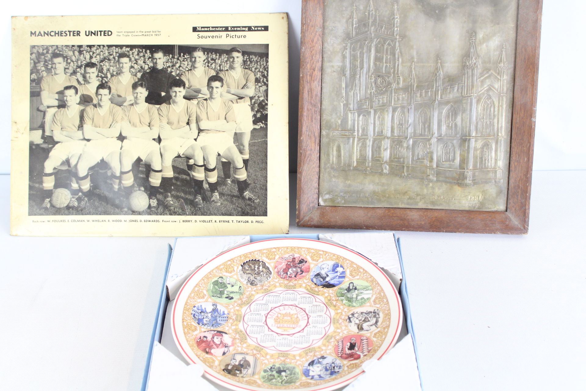 A Trio of Collectibles including 1957 Manchester United Souvenir Photo, 1891 Repousse Metal Panel, and Wedgwood Millennium Plate