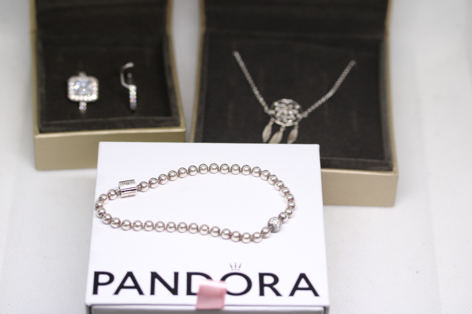 Collection of jewellery - Panroa charm brace, 2 Warren James silver rings & silver necklace & dream catcher pendant