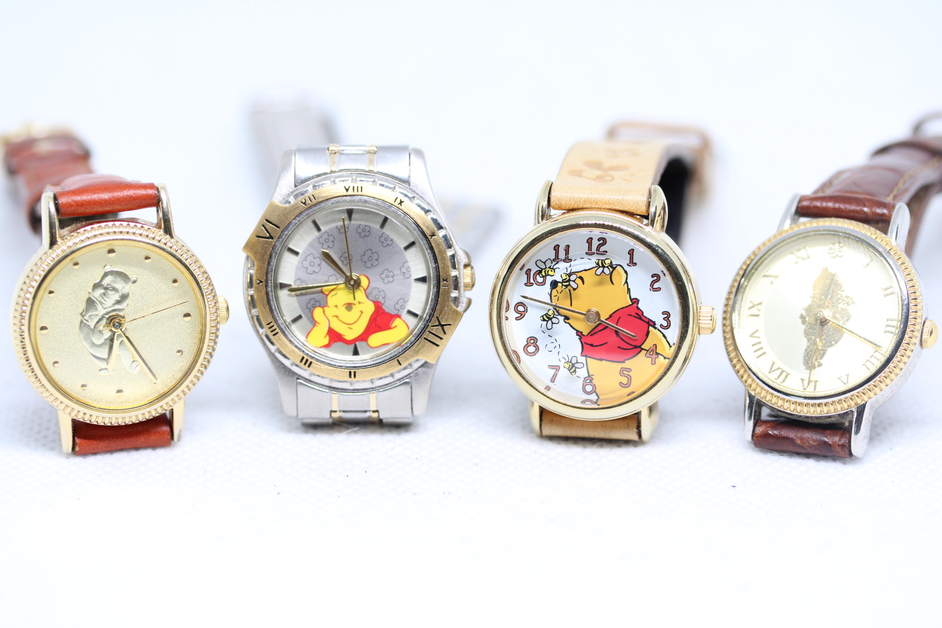 Four Genuine Disney, Pooh Bear Quartz Watches.