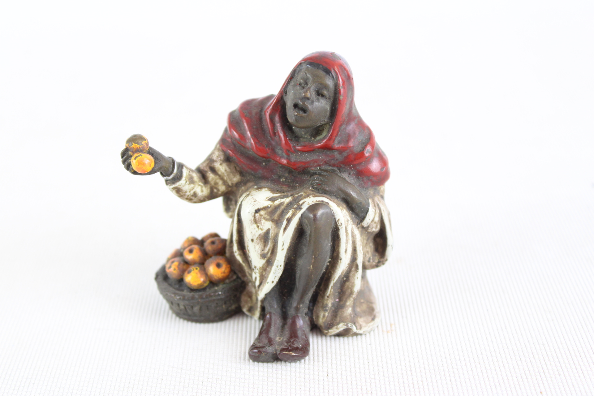 Bronze cold painted ornage seller