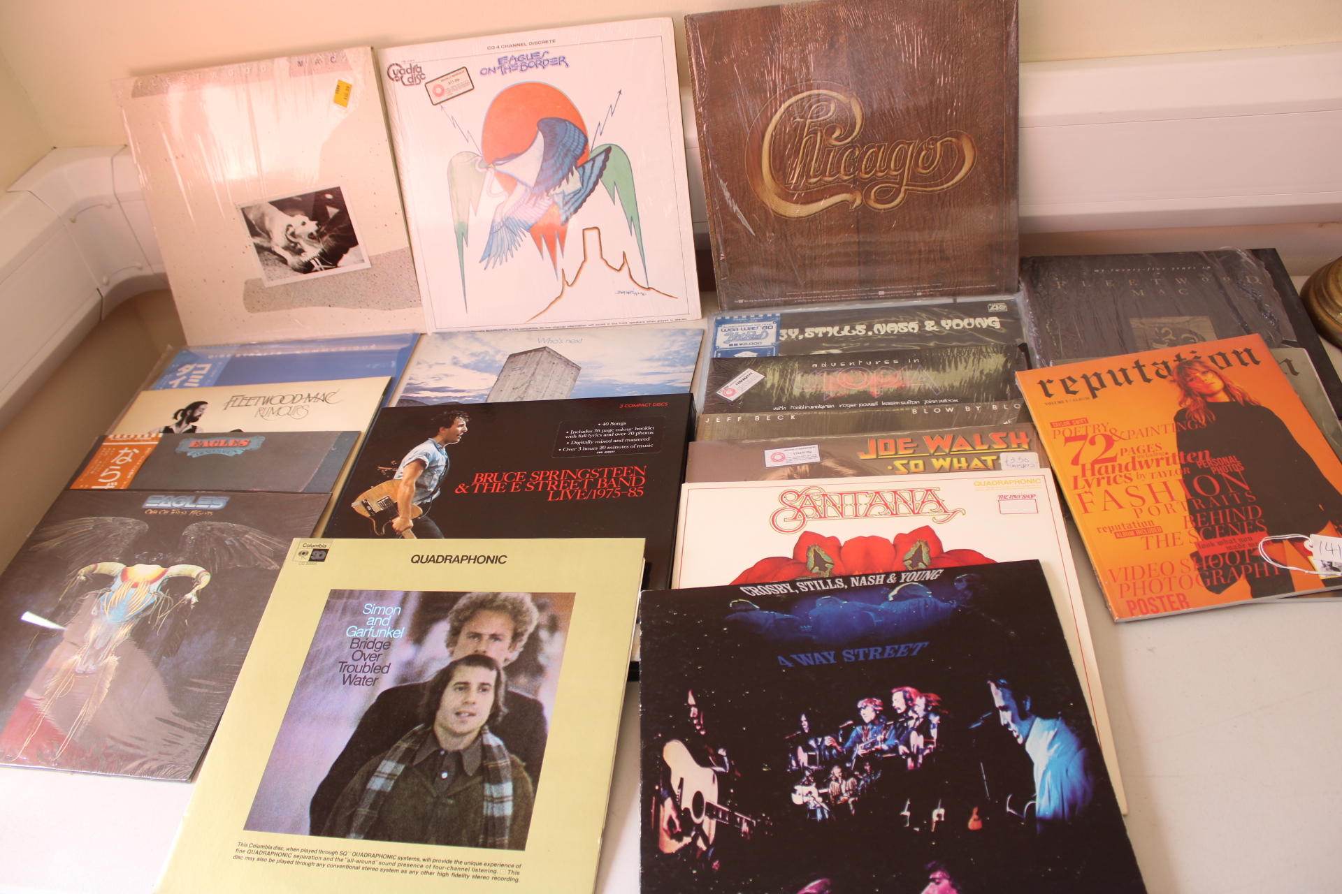 A Collection of Rock and Pop Vinyl Records, CDs, and Taylor Swift Artist Magazine