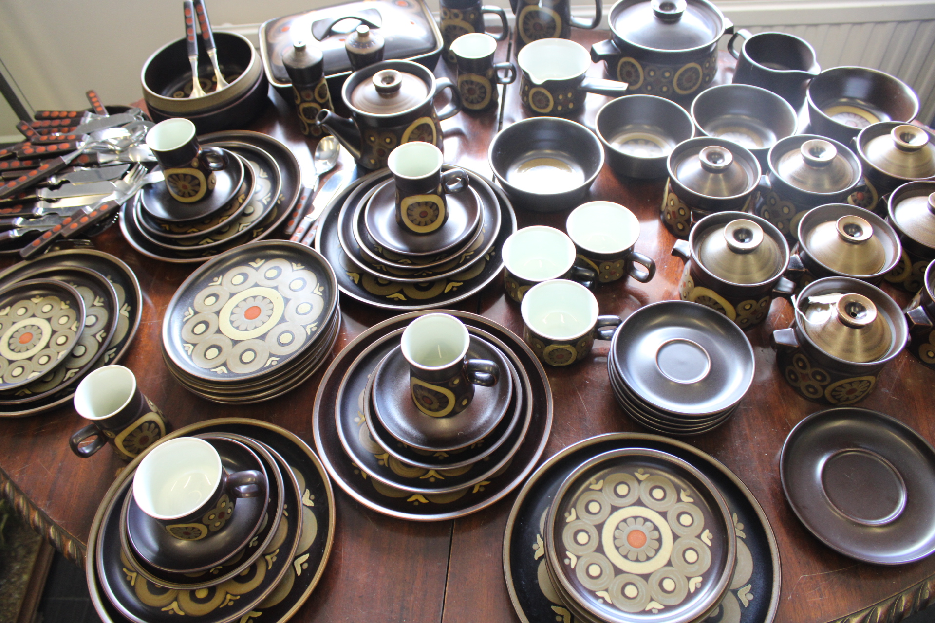 A Large Collection of Denby Arabesque Pattern Stoneware Tableware and Matching Flatware