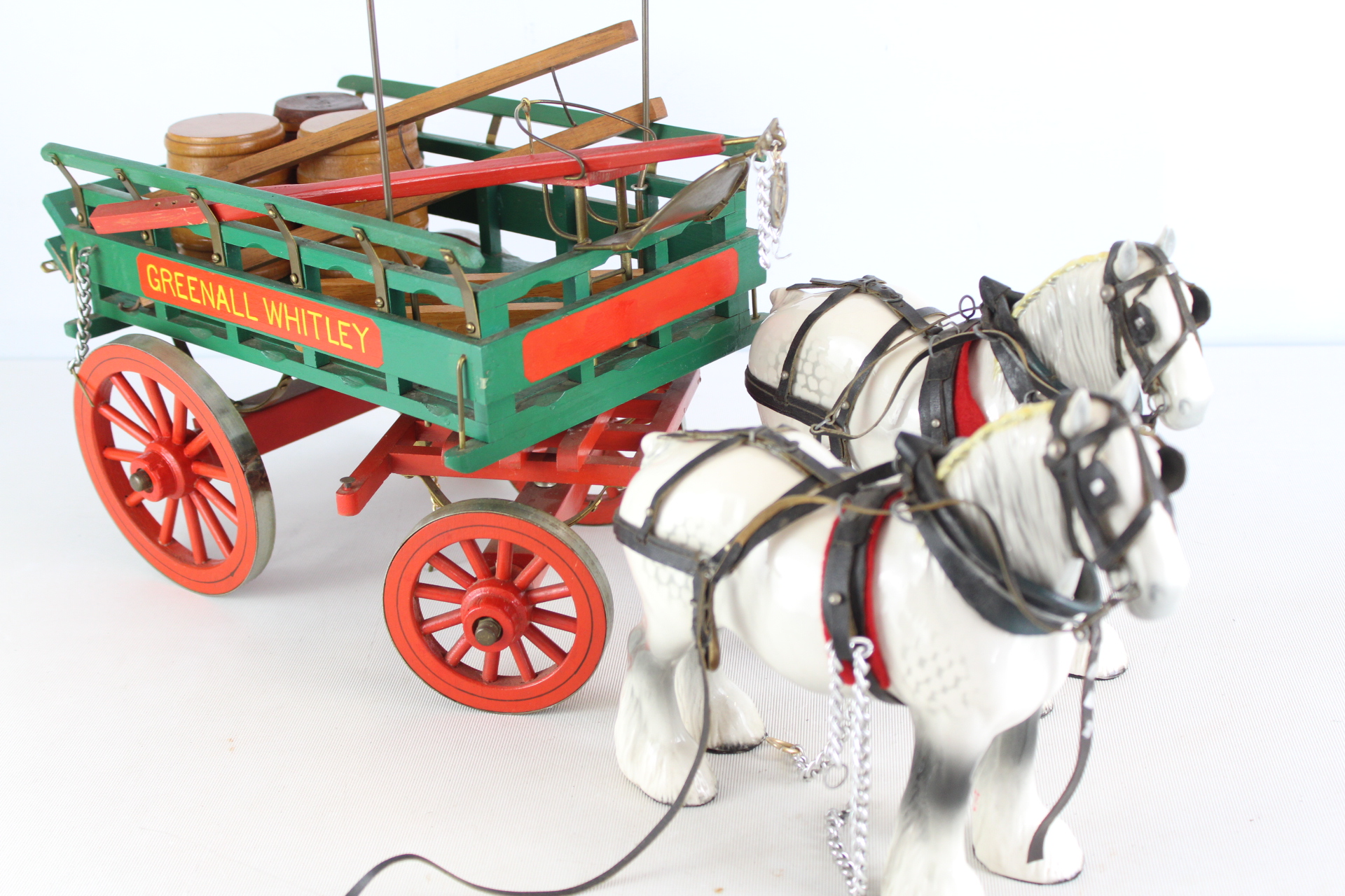 A Beswick Porcelain Greenall Whitley Brewery Dray Set with Two Shire Horses