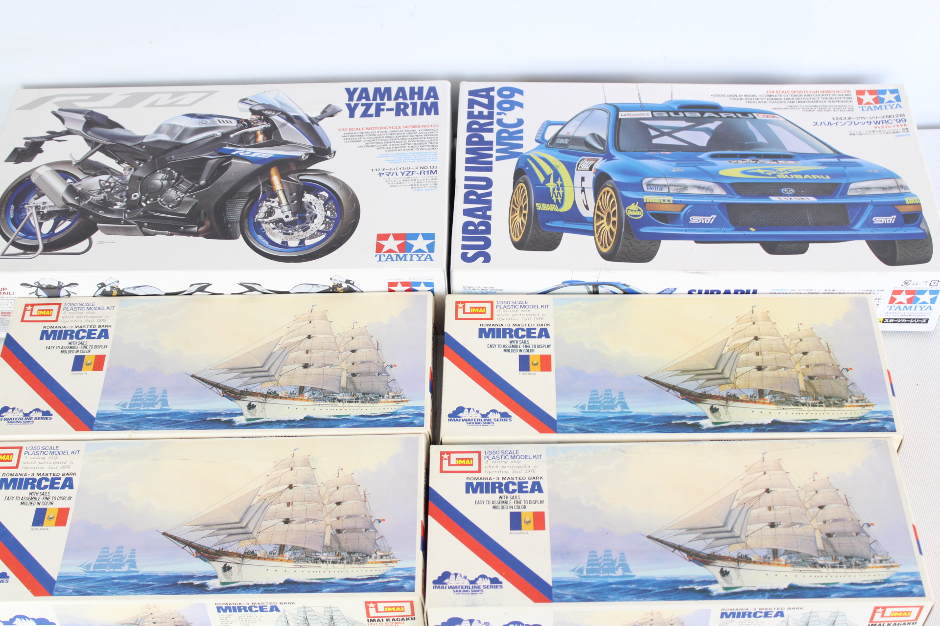 Six Tamiya and IMAI Unassembled Plastic Model Kits Including Yamaha YZF-R1M and Subaru Impreza WRC 99