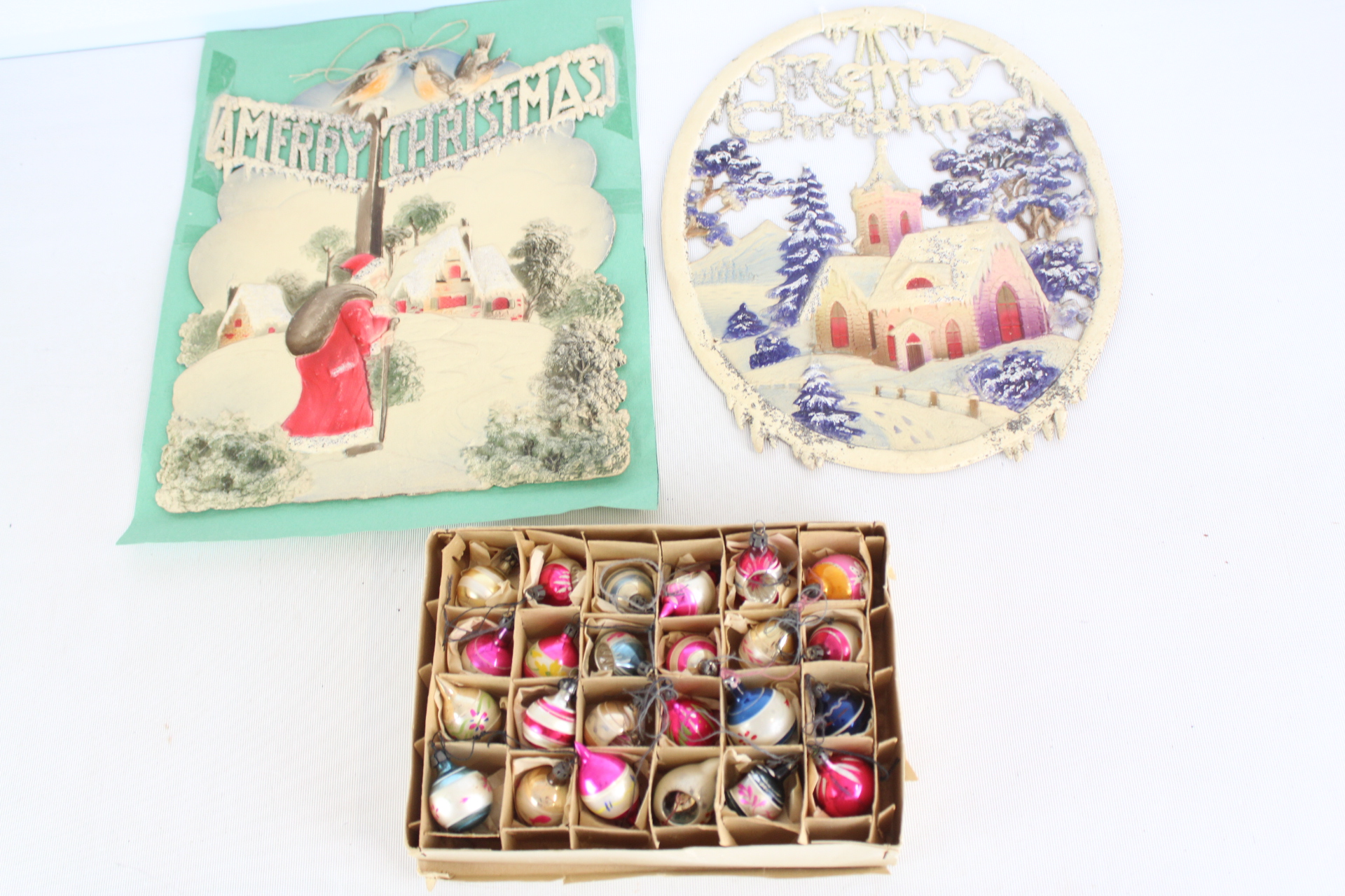 A Trio of Vintage Christmas Decorations Including Large Die-Cut Chromolithographs and a Boxed Set of 24 Miniature Glass Ornaments