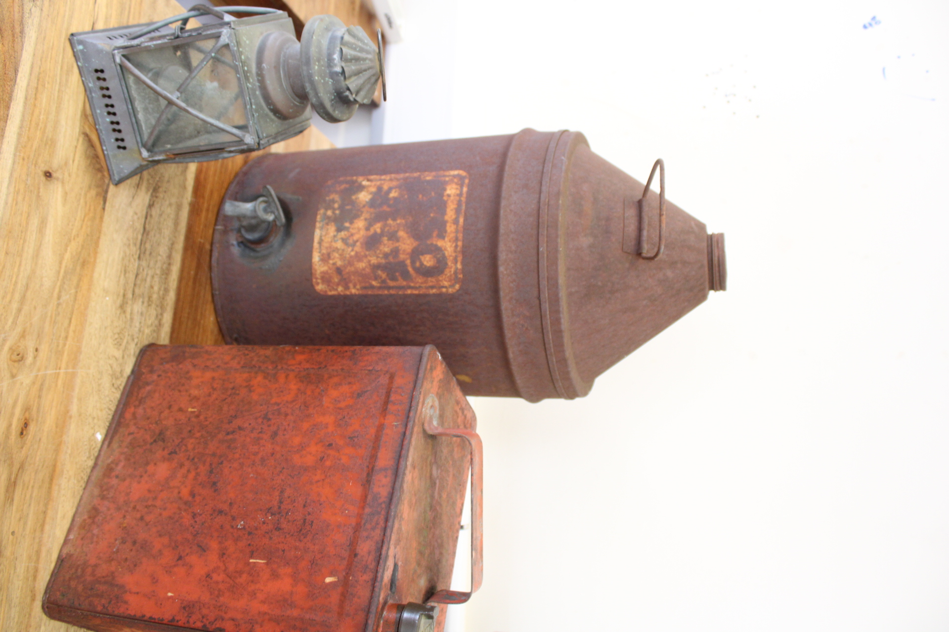 A Trio of Vintage Industrial and Automotive Metal Containers including a Lantern and Oil Cans