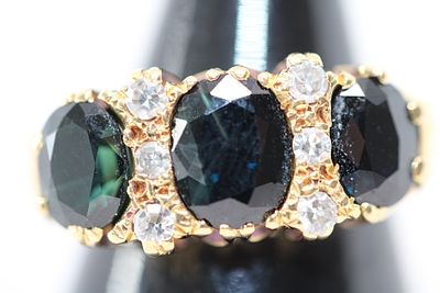 An 18 Karat Yellow Gold Three-Stone Teal Sapphire and Diamond Ring Weight 7.2g Size N. This 