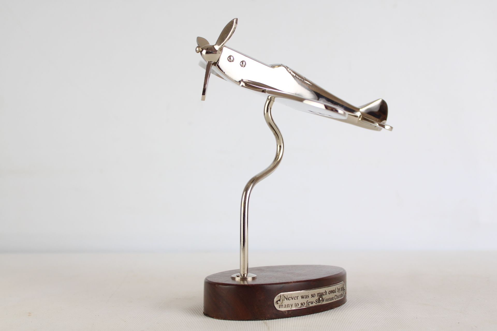 Chrome spirtfire on wooden base