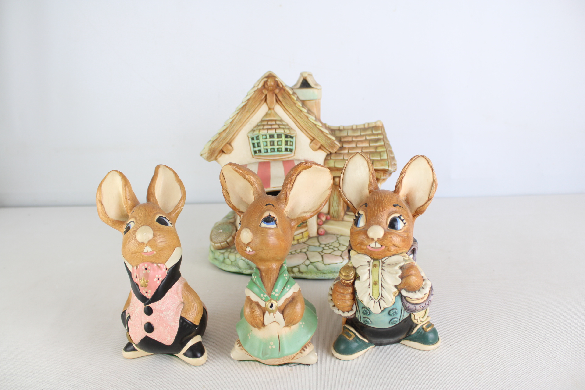 Collection of PenDelfin Ceramic Rabbit Figurines and Storybook Cottage