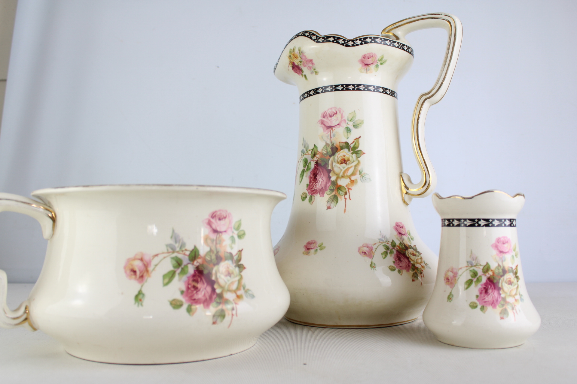 A Trio of Floral Ceramic Wash Set Pieces