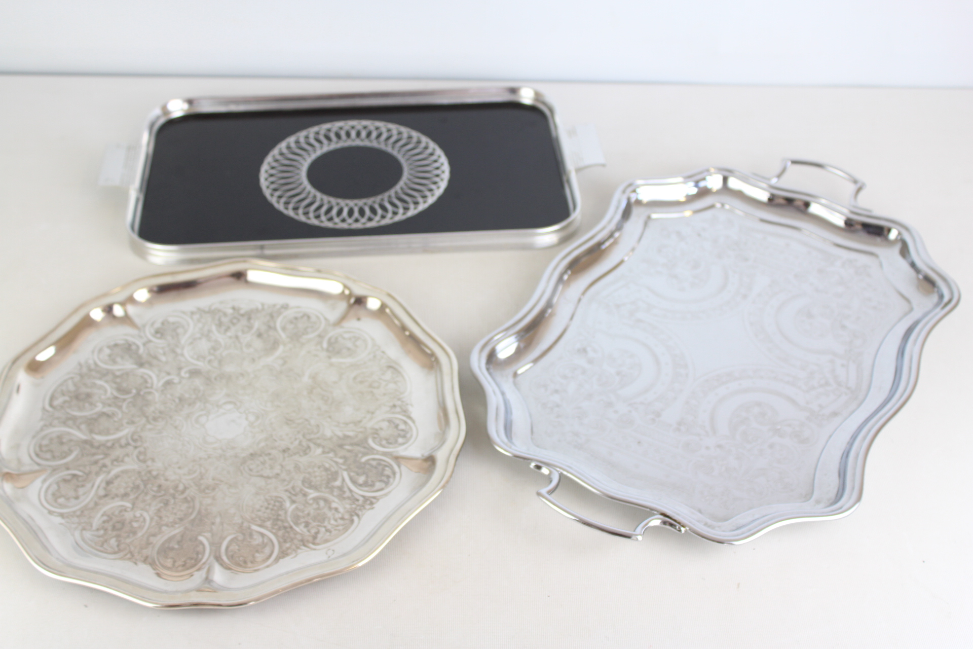 Three Assorted Silver-Plated and Decorative Serving Trays