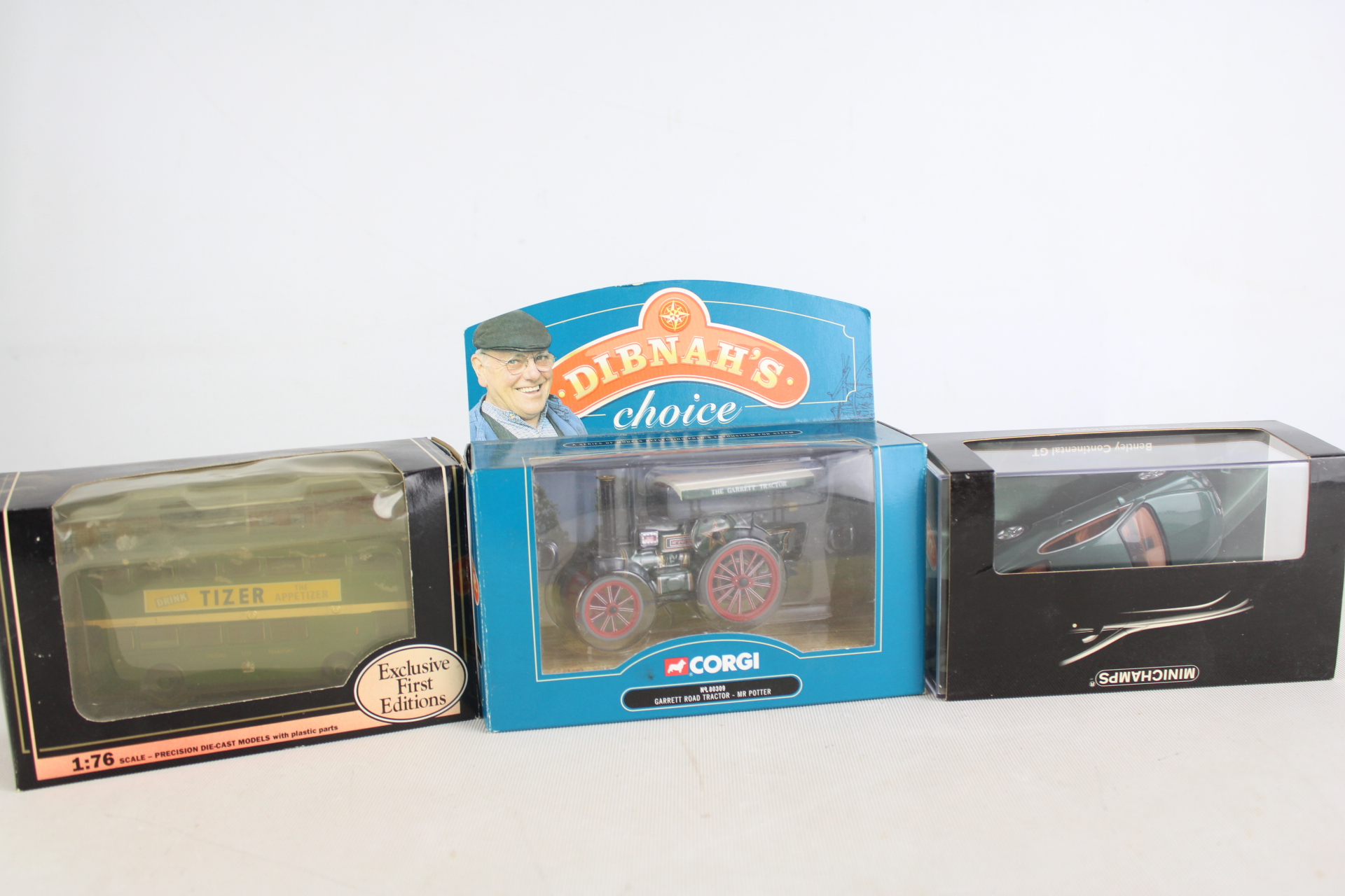Three Boxed Die-Cast Model Vehicles by Corgi, Exclusive First Editions, and Minichamps