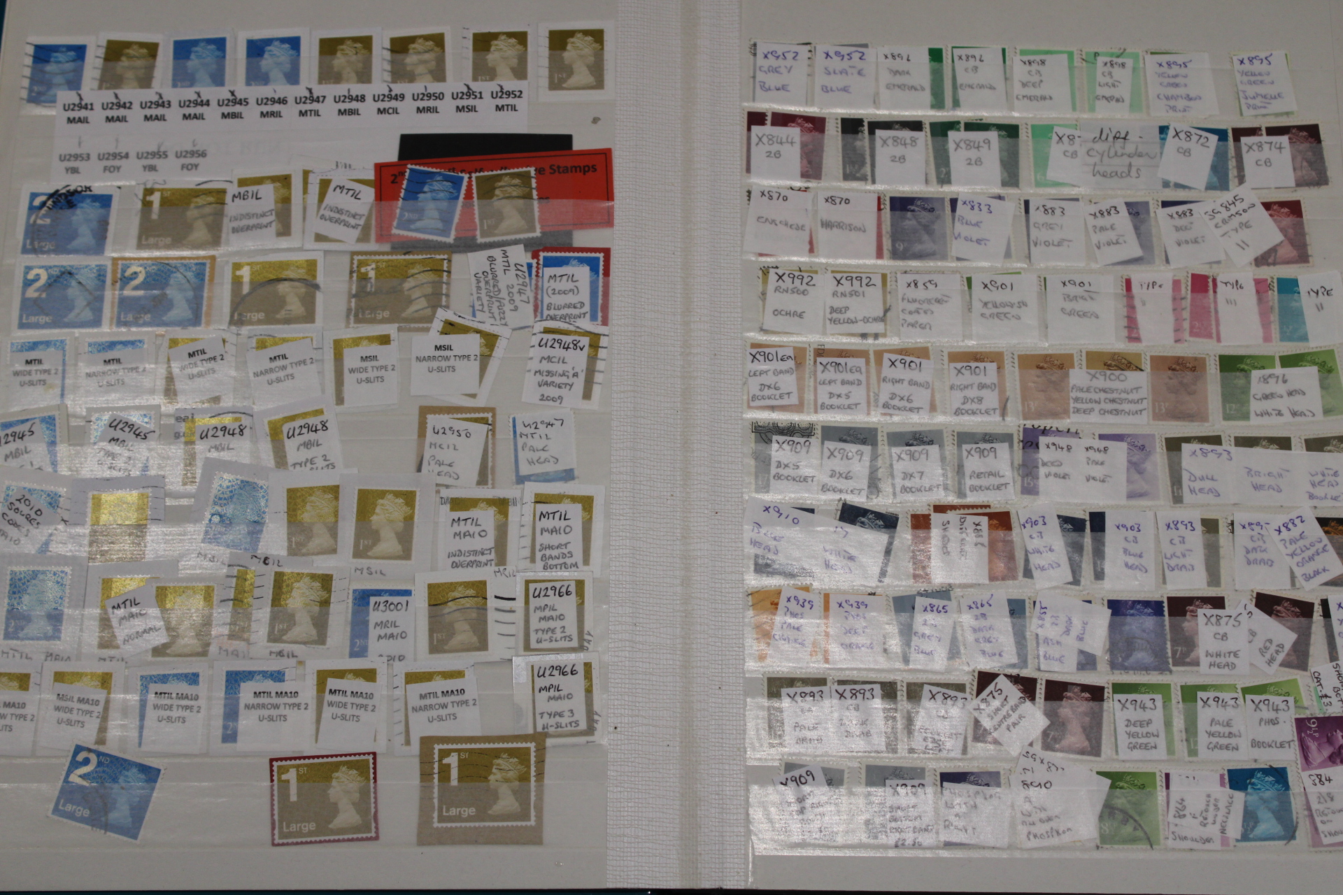 An album of Queen Elizabeth II stamps - many pages