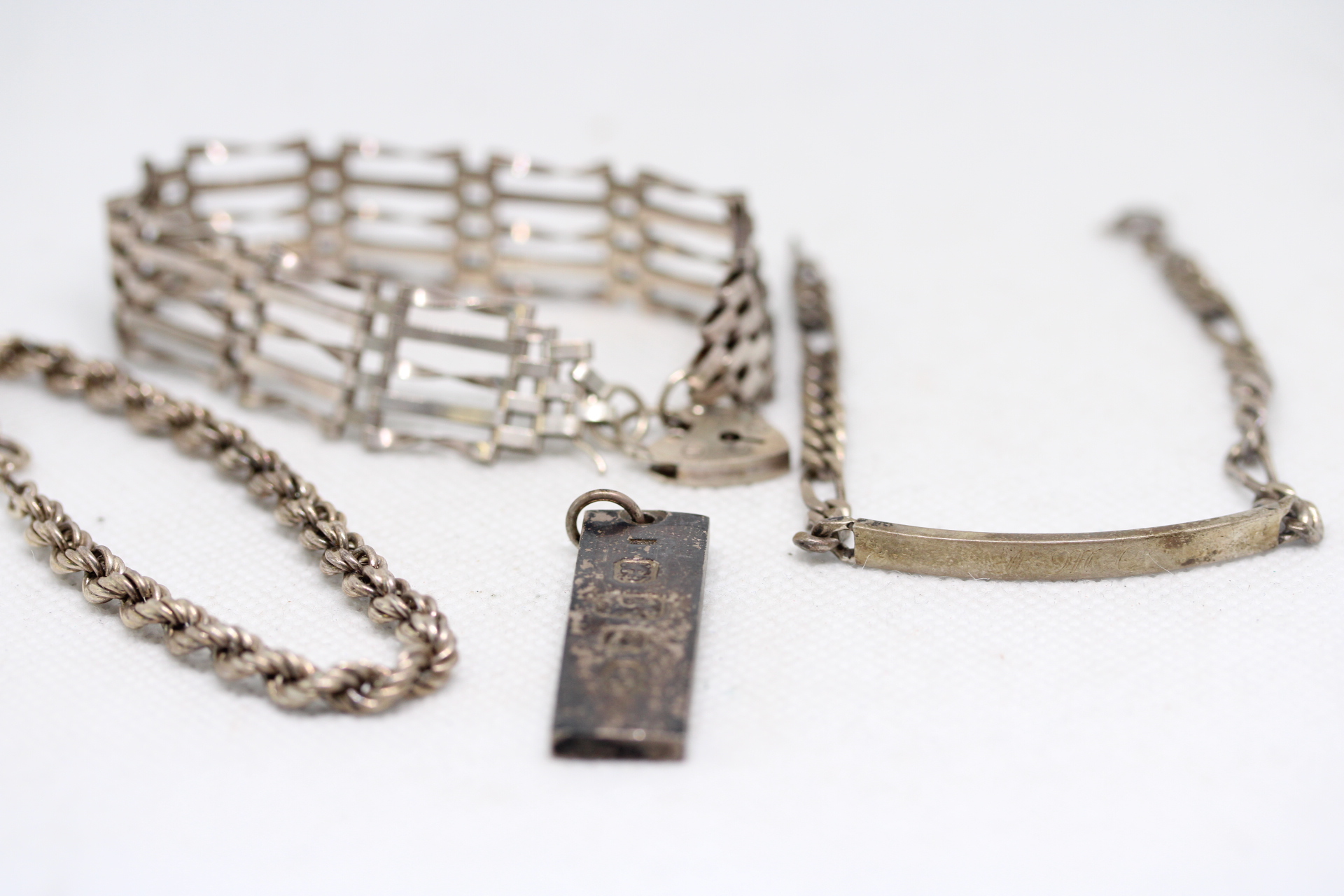 Silver gate bracelet, silver ID bracelet, silver rope bracelet & silver ingot Total weight 46g