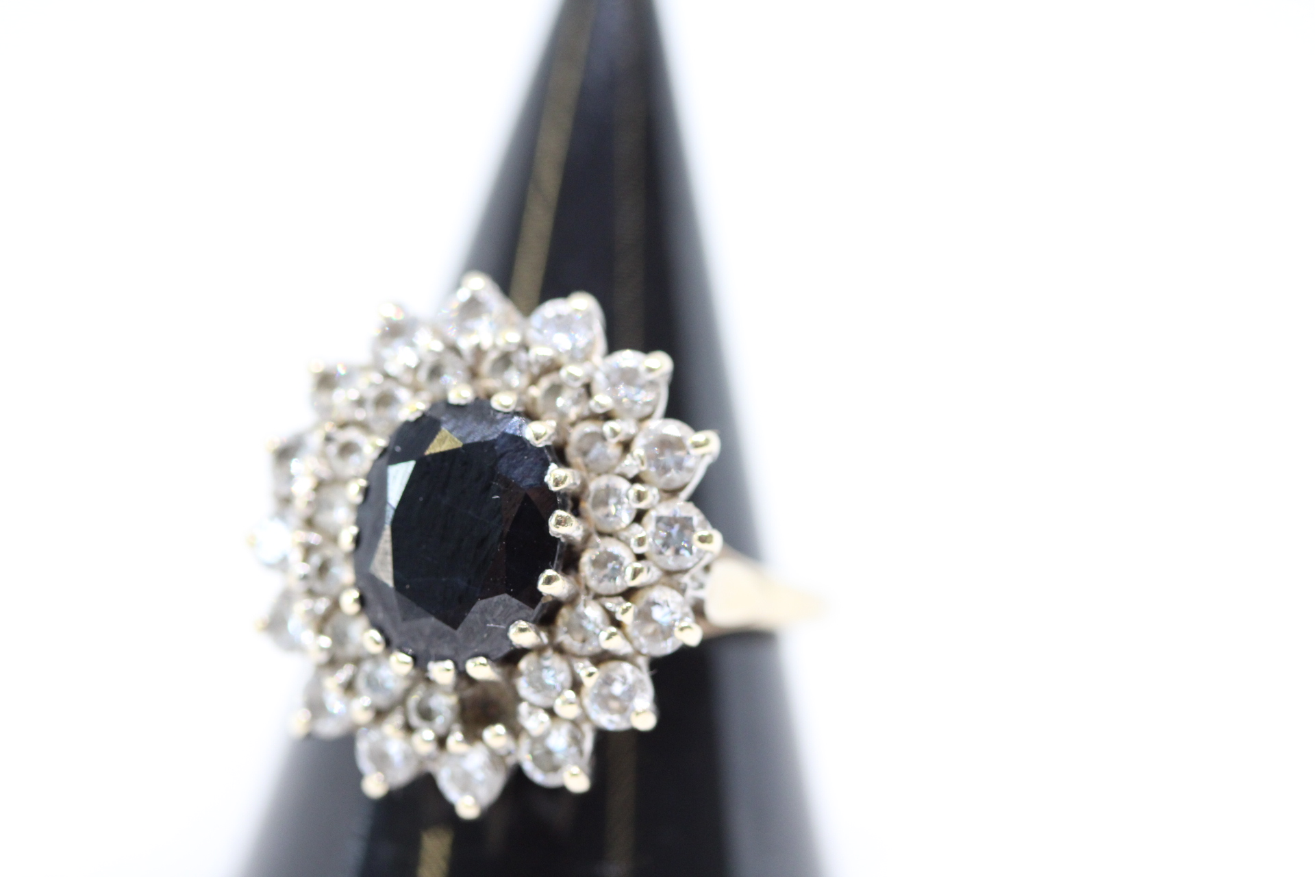9ct Gold ring set with white & central green stones - 1 stone missing