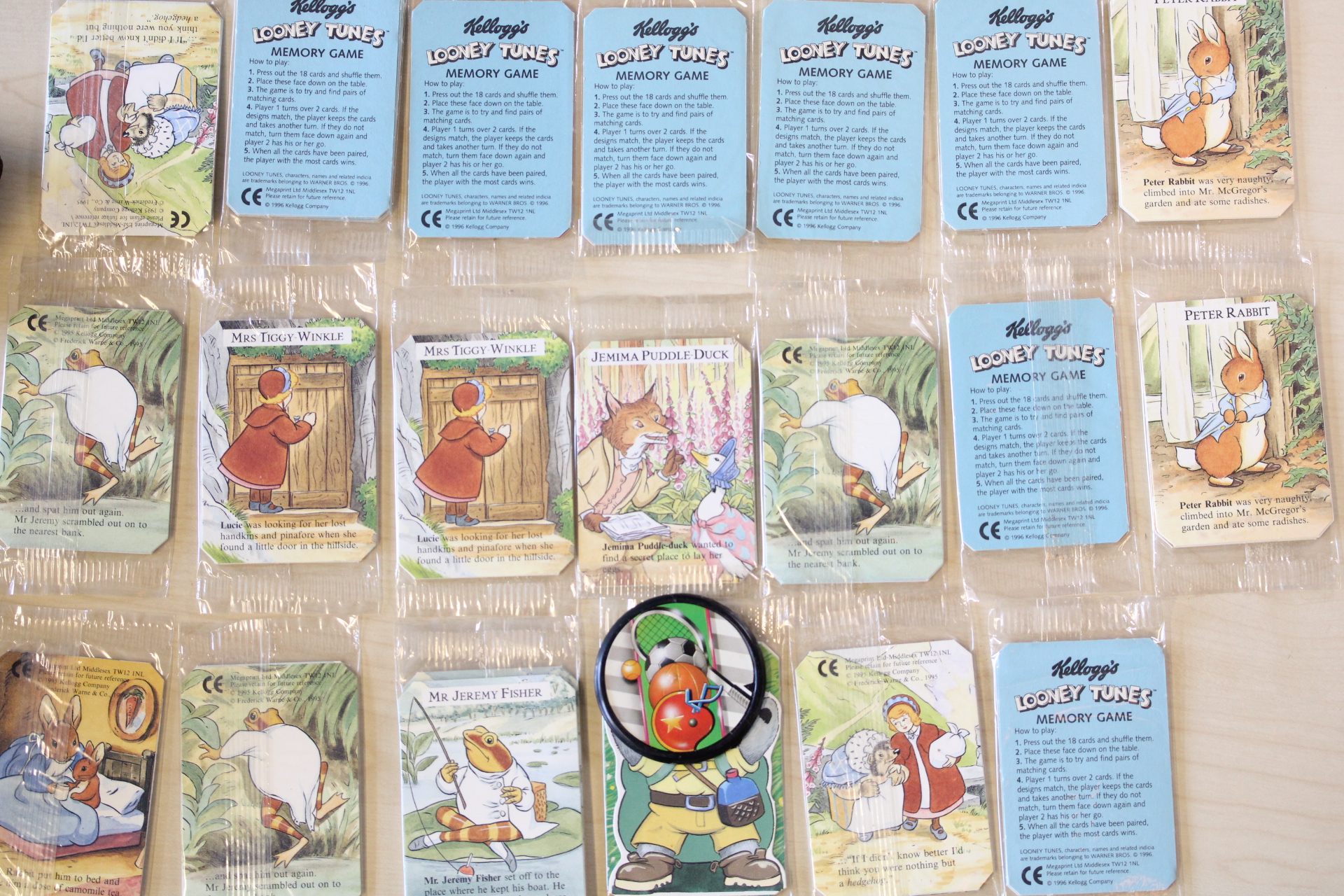 A Collection of Vintage Kellogg's Promotional Trading Cards featuring Beatrix Potter and Looney Tunes