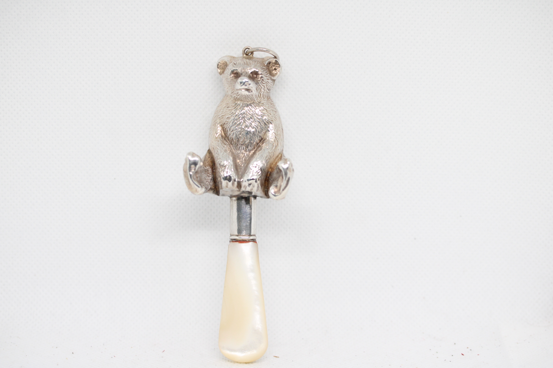Silver & mother of pearl large baby rattle with a bear. William Vale & Sons Chester 1927