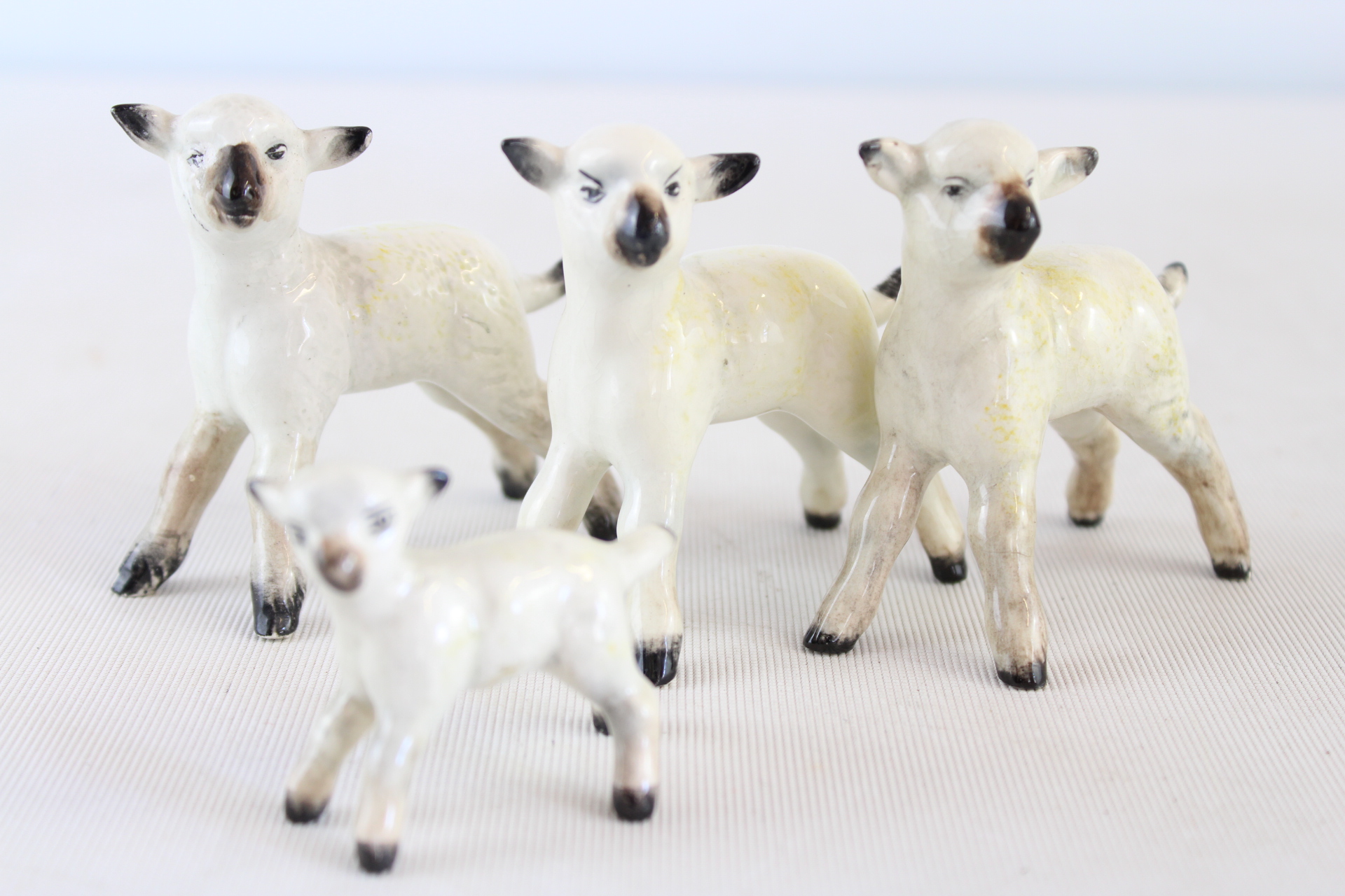 A Set of Four Beswick England Ceramic Lamb Figurines