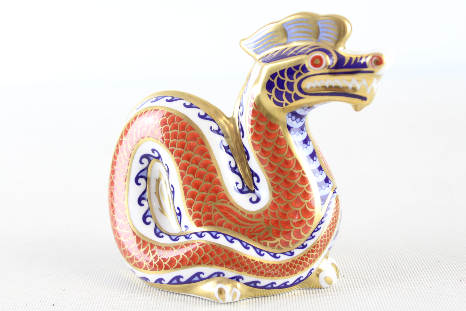 Royal Crown Derby Porcelain Dragon Paperweight with gold stopper